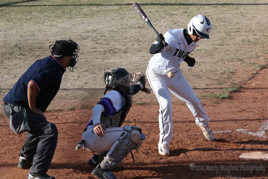 Richie Gonzales takes the ball in the belly late in the game with Rye Tuesday afternoon.