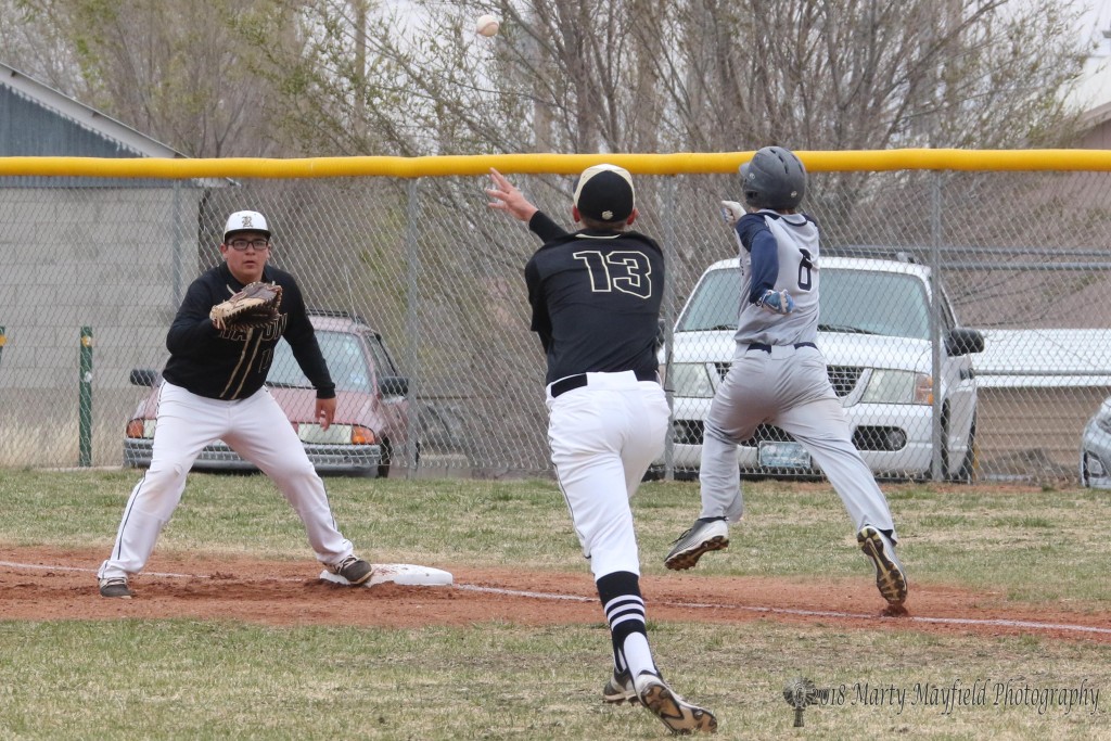 Matthew Quarter makes the throw to first baseman Jadyn Romero as Sam Little races to first base during the Saturday double header at Gabrielle Field. 