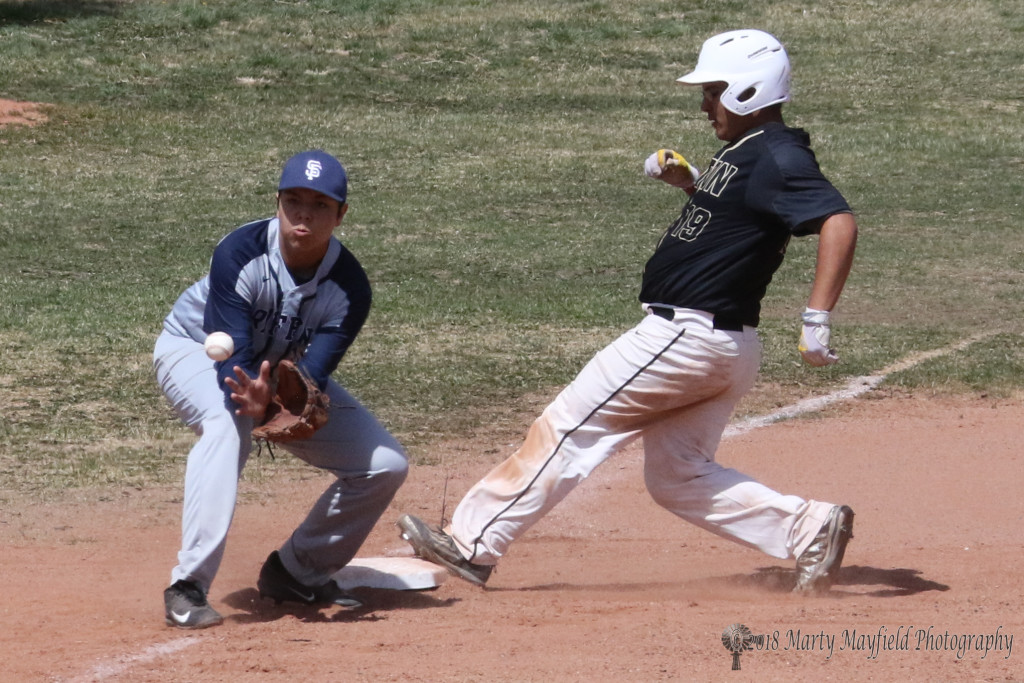 Another stolen base as Brandon Decker just beats the throw to Jack Veenstra at third base Saturday afternoon.