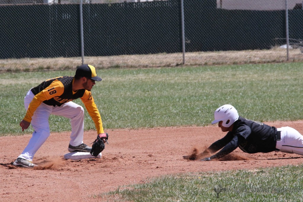 Richie Gonzales goes for second but was a bit late as the ball arrived in Bryon Chavez's glove well ahead of Gonzales Saturday afternoon in Raton.