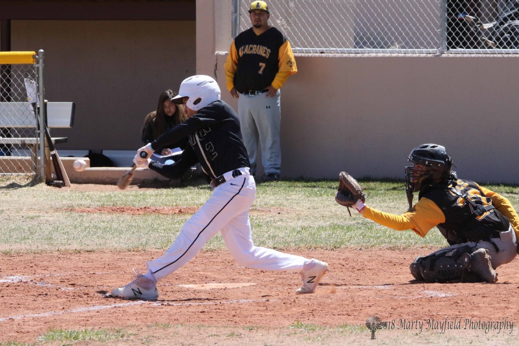 Richie Acevedo takes aim on the ball and sends this one into the outfield to advance base runners one base as Coach Mike Marez once agains held the boys up with a huge lead in the game against Tierra Encantada.