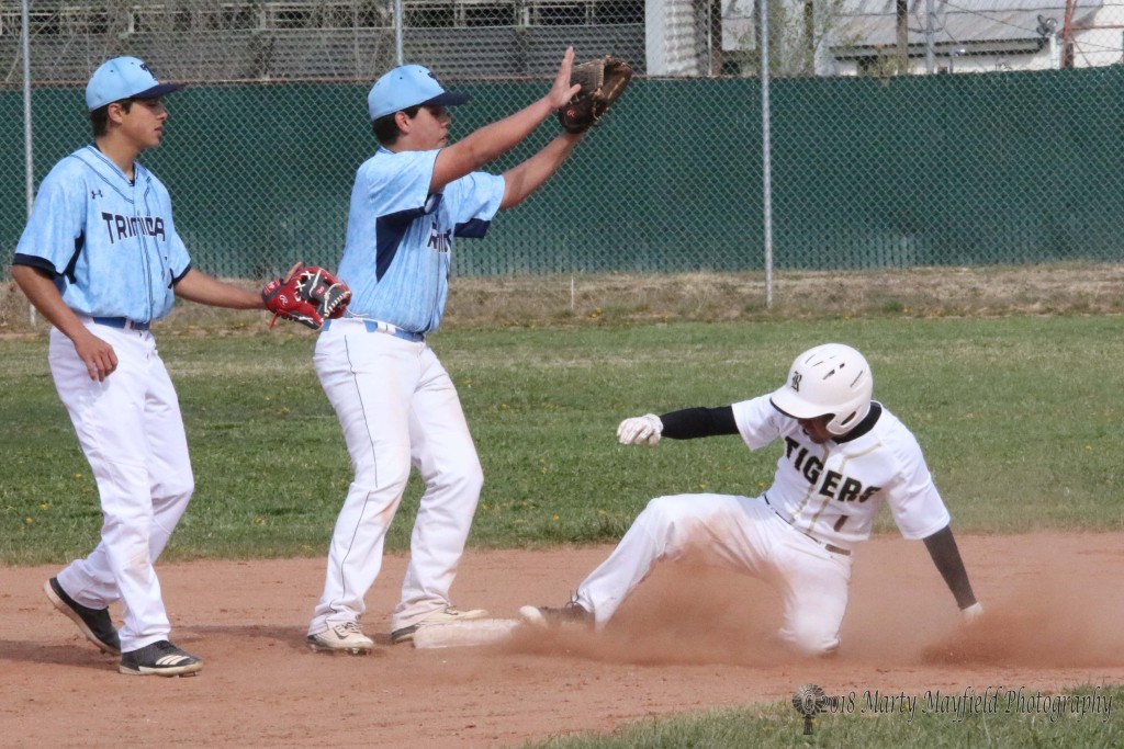 Dustin Segura steal second on an error to first base Tuesday afternoon as Raton hosted Trinidad for a single game