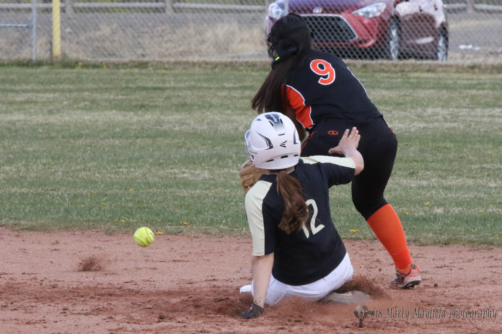 Andie Ortega beats the ball to second base as Desiree Martinez sets up for the tag Tuesday afternoon at Jim Wade Field against Taos