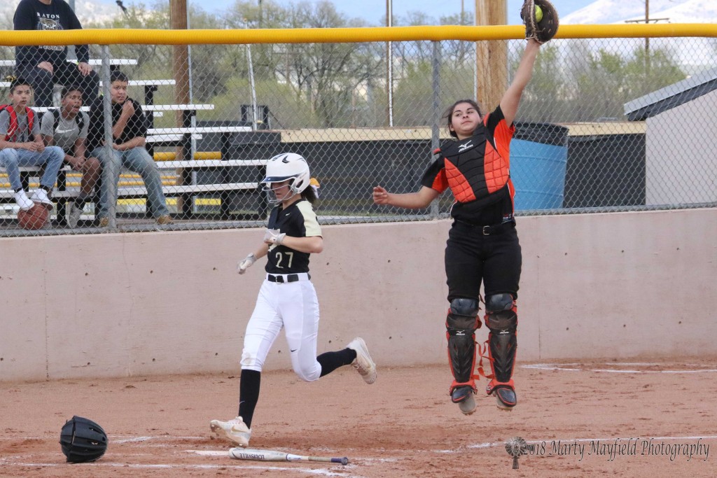 Camryn Mileta beats the ball into home plate as Raton adds another run to the scoreboard Tuesday afternoon against Taos at Jim Wade Field