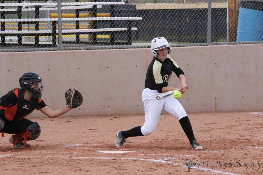 Halle Medina gets a hit to advance the runners Tuesday afternoon against Taos.