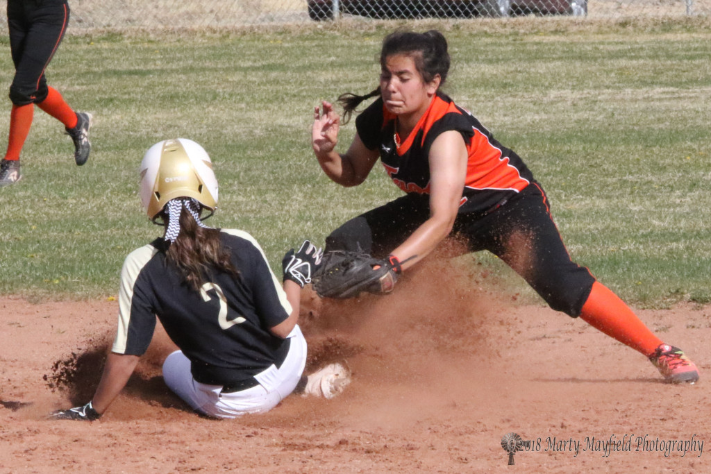 Natausha Ortega slides to second just ahead of the tag Tuesday afternoon in Game one of the double header at Jim Wade Field against Taos