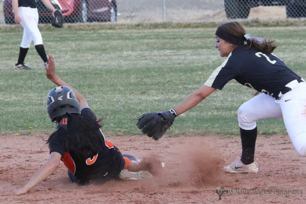 Natausha Ortega reaches out for the tag but is too late as Maddalynn Quintana reaches second base before Ortega can make it for the tag.